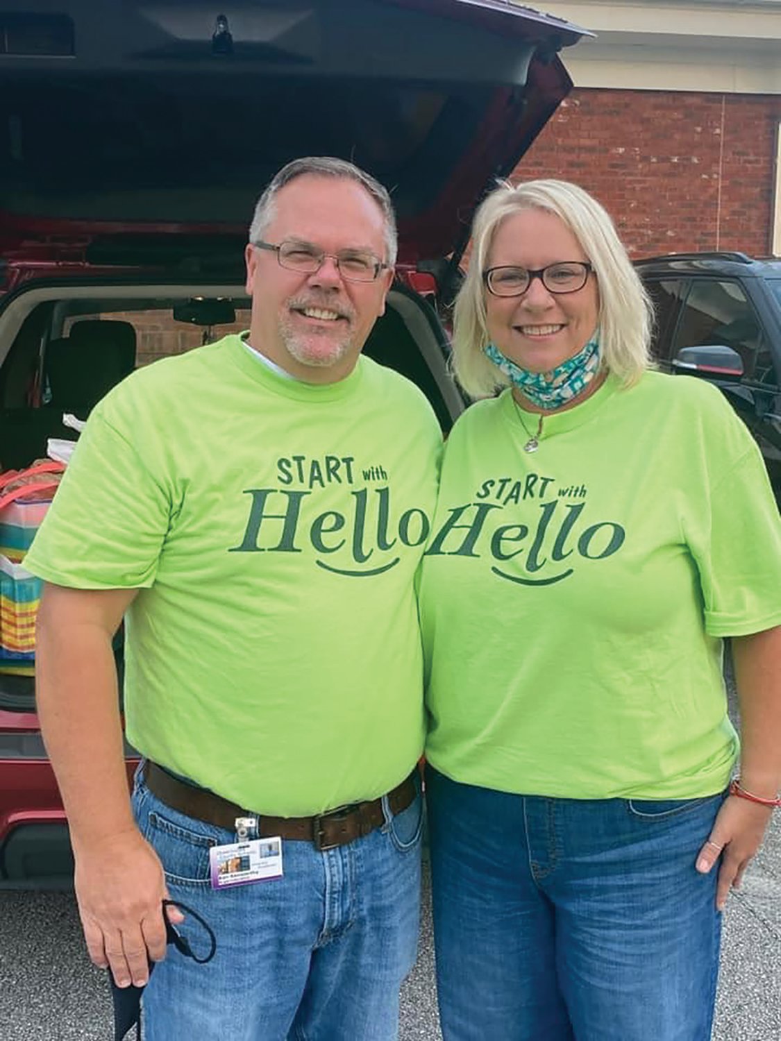 Superintendent Ken Kenworthy and Johanna Kenworthy wear their own Start With Hello shirts to support the movement.